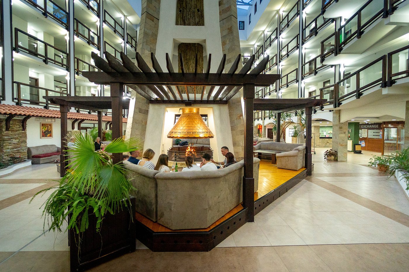 Guinness central lobby with seating around a large fireplace